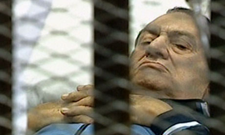 Photographic Image of Hosni Mubarka Behind Bars in an Egyptian Court of Law