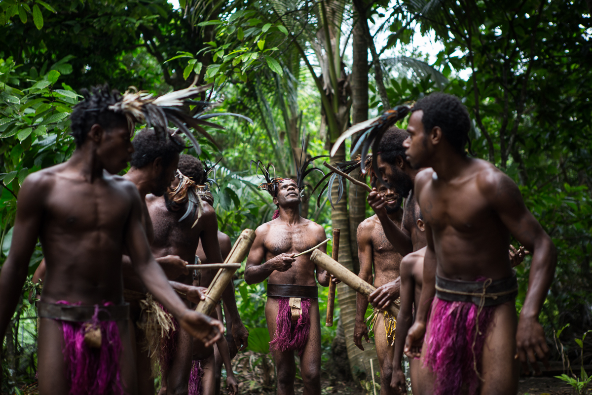 A photograph of Vanuatu performing a ritual dance.