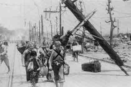 Photographic image of a homeless Japanese family led by what appears to be a Japanese soldier who had returned from war.